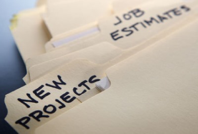 Image of file folders labeled 'new projects' and 'job estimates' depicting the need to make winning project proposals.