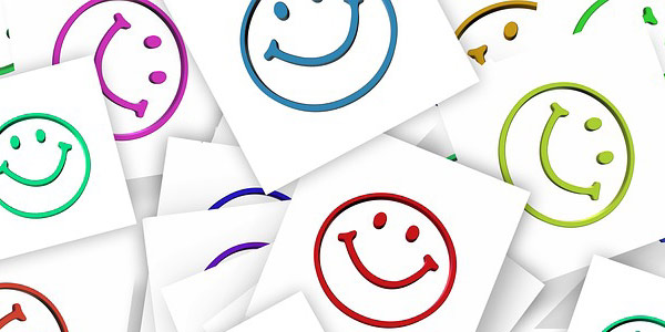 Image of 'happy face' stickers signifying happy end-users in IT service negotiations.