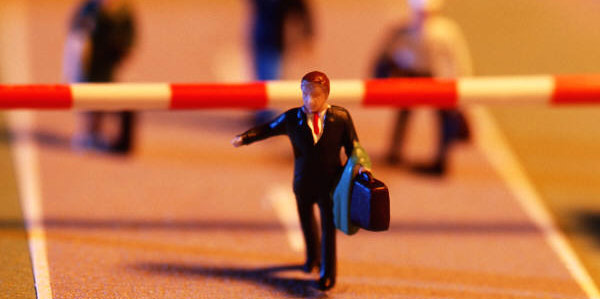 Image of businessman passing a checkpoint signifying the need for project checkpoints.