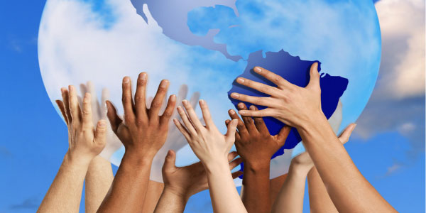 Image of large globe being held up by multiple people demonstrating the benefit of having sponsors and mentors.