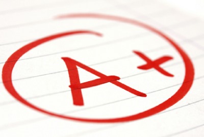 Image of report card with a grade of 'A+' signifying the need to apply lessons learned techniques to projects.